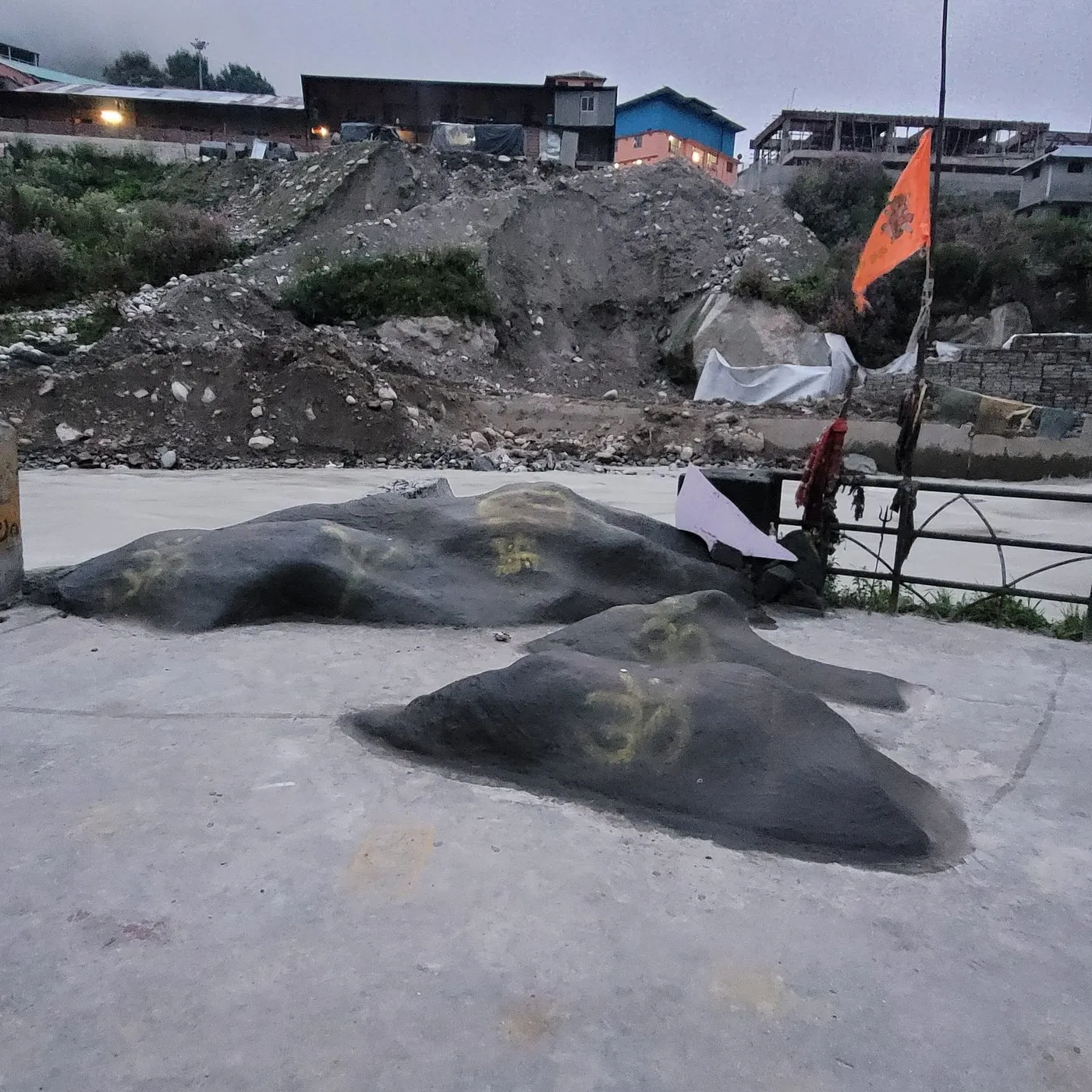 Brahma Kapal sacred platform with orange flag and Om marking on the rocks